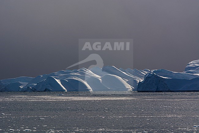Icebergs and melting pack ice in Ilulissat Icefjord, an UNESCO World Heritage Site. Ilulissat Icefjord, Ilulissat, Greenland. stock-image by Agami/Sergio Pitamitz,