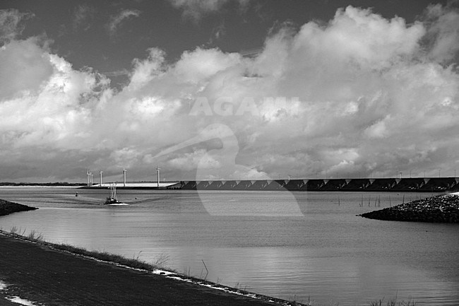 Fishing Boat enters the harbour of Stellendam with the Haringvlietsluizen on the background, Vissersboot komt haven van Stellendam binnen met op achtergrond Haringvlietsluizen stock-image by Agami/Bas Haasnoot,